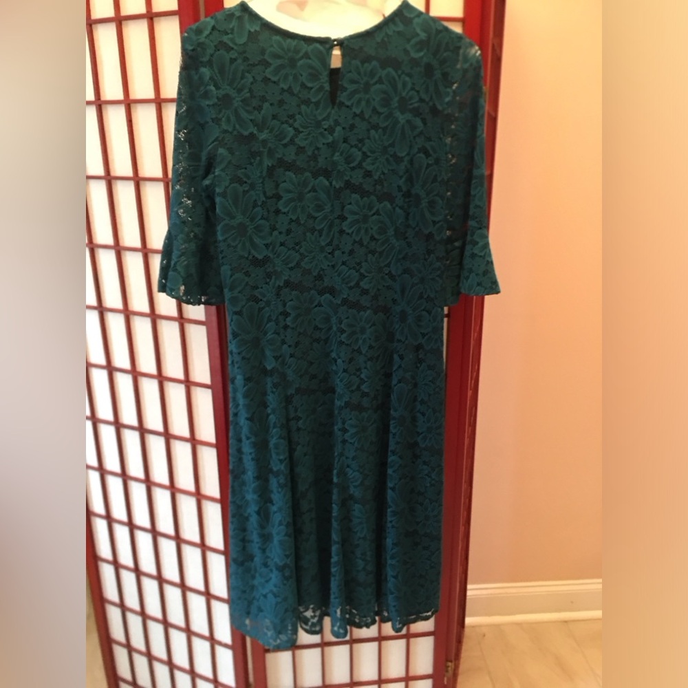 Dark green lace dress in size XL.